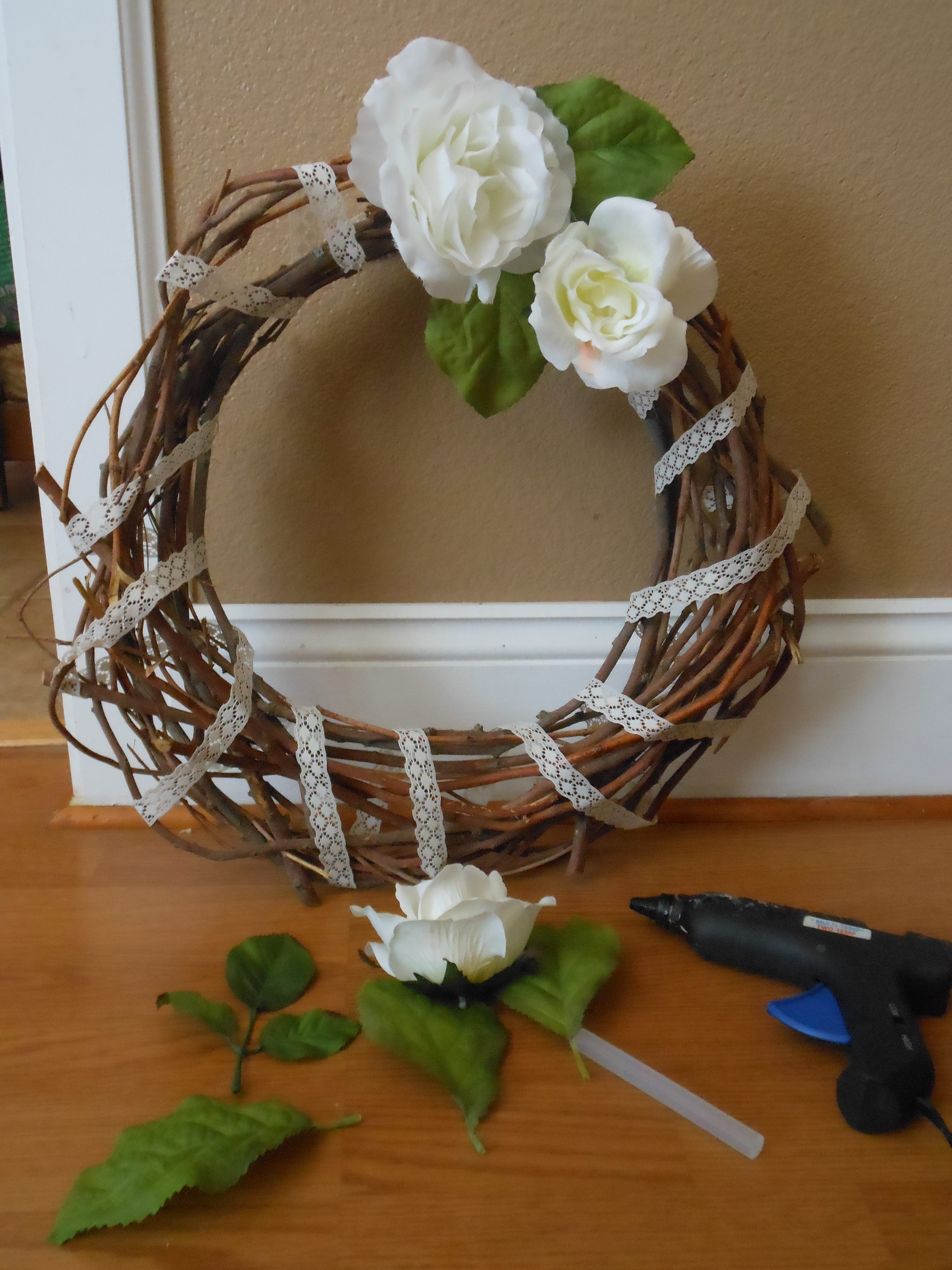 Add flowers to wreath